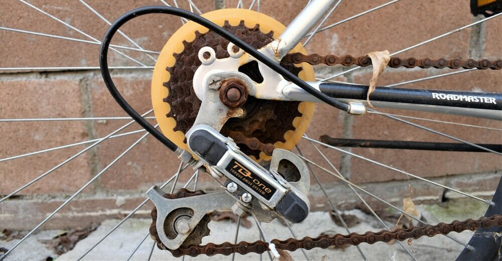 A rusty bicycle chain - symbolic of a broken bicycle