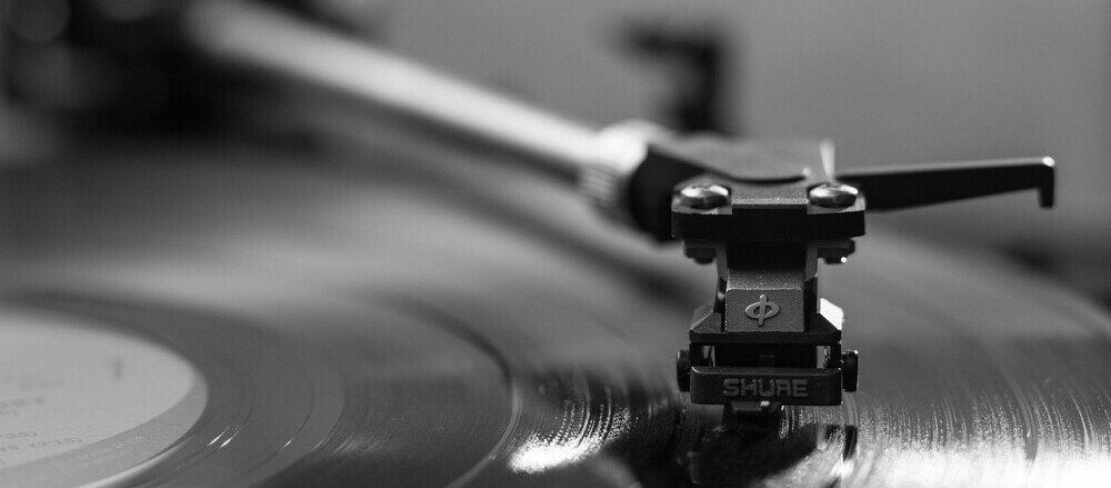 A record player stylus in operation A record player stylus in operation